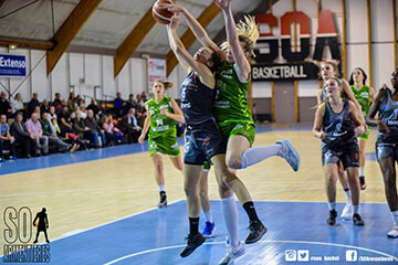 basketball game where Karla in green jersey is blocking another player